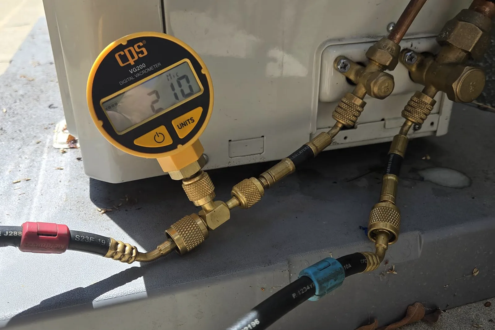 Vacuum gauge reading 210 microns during the deep vacuum on the repaired system