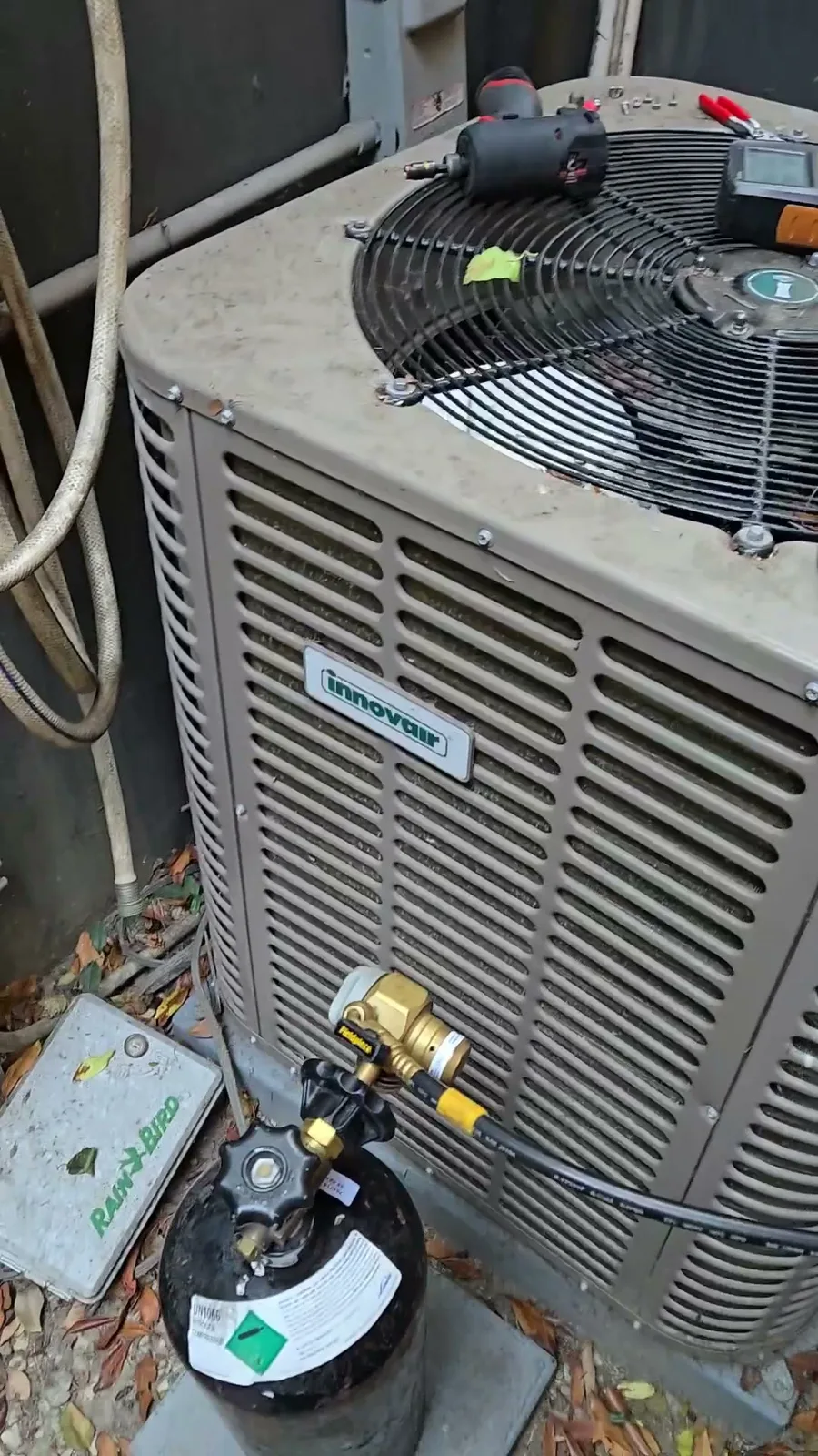Innovair inverter heat pump outdoor unit at a home in Santa Monica, with a nitrogen cylinder connected for the leak test