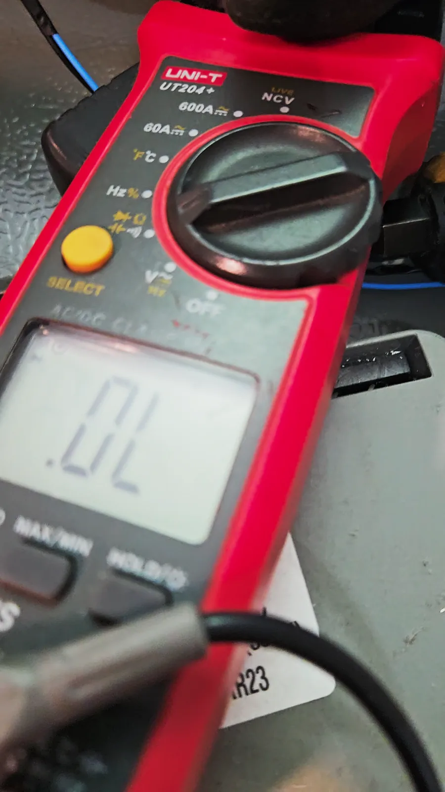 Meter display reading OL in diode mode, meaning nothing conducts between the two measured points