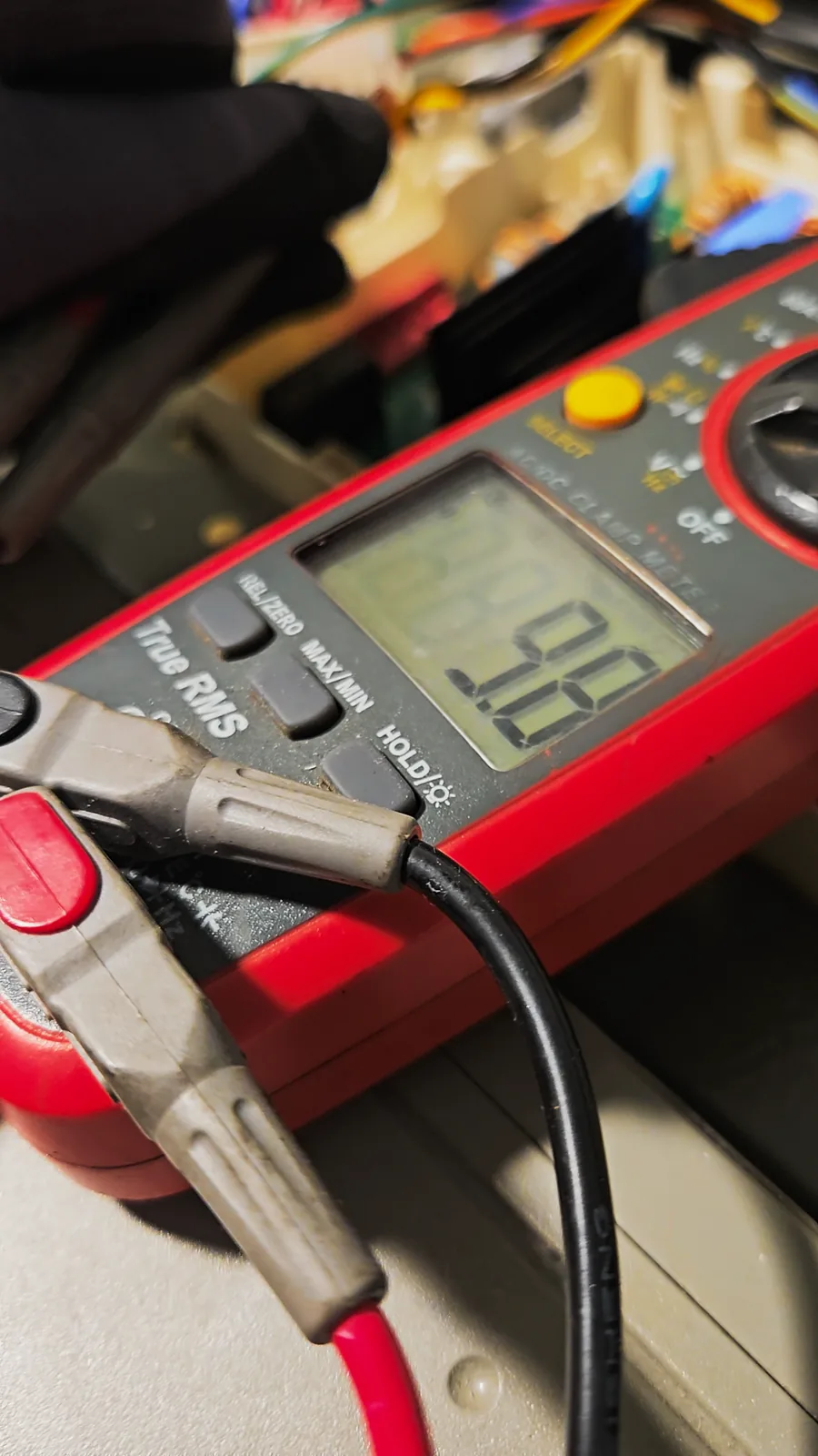 Meter display reading 9.8 ohms across one pair of compressor terminals