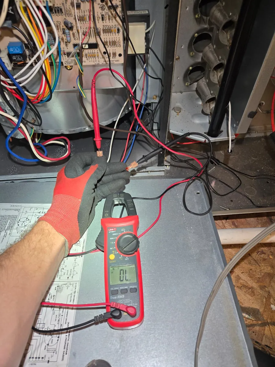 Epic Star technician testing furnace wiring with a clamp meter in Encino, CA