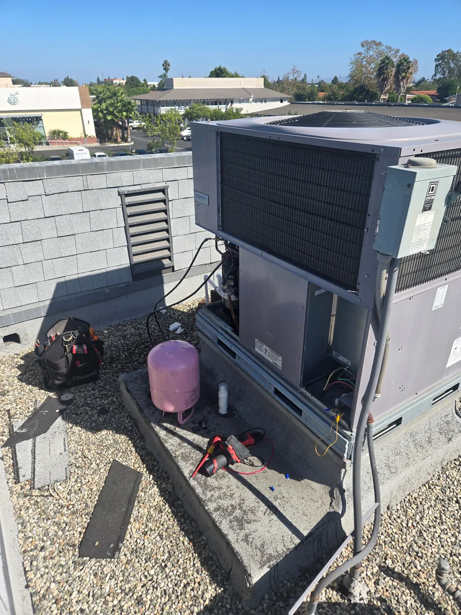 Packaged HVAC equipment on a rooftop during service
