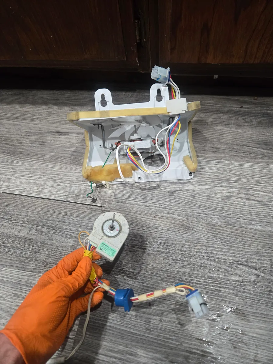 Whirlpool refrigerator evaporator fan assembly shown during service